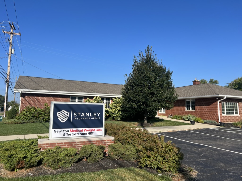 New You Medical weight loss clinic exterior in Hilliard, OH with brick building and Stanley Insurance Group signage